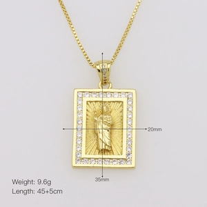 Macro shot of gold cross pendant with Jesus relief and cubic zirconia details