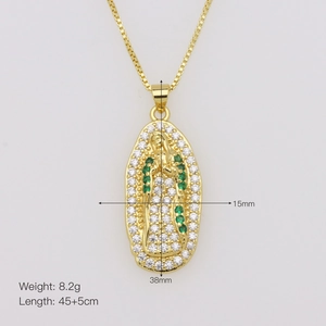 Detailed view of gold oval medallion with Virgin Mary icon and green zircon stones