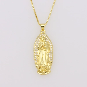 Detailed close-up of Virgin Mary gold pendant with sparkling white zircon stones
