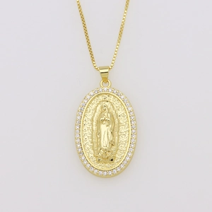 Detailed macro view of 18K gold-plated Guadalupe pendant with white cubic zirconia inlay