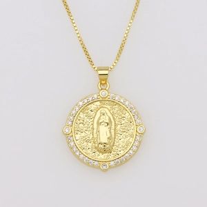 Detailed close-up of golden Virgin Mary pendant with cubic zirconia frame and hammer texture