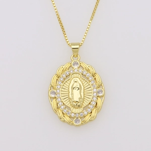 Close-up of gold Virgin Mary oval pendant with zircon stones and fine chain