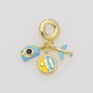 Detail view of gold camera, star charm, and airplane travel pendants for bracelets