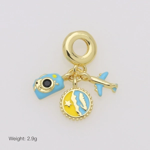 Detail of travel charms with blue camera and airplane on gold-plated base, weight 2.9g