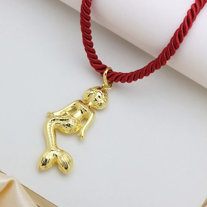 Exquisite gold-plated mermaid pendant necklace with textured scales on a red twisted cord