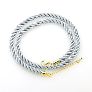 Detail of silver-grey twisted polyester cord necklace with gold lobster clasp and chain