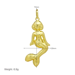 Detailed view of a gold mermaid pendant with size annotations 73mm by 29mm