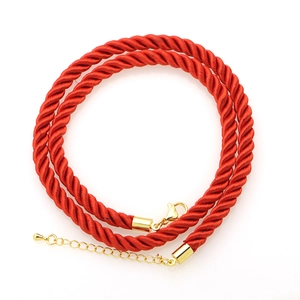Macro detail of red 6mm twisted polyester cord necklace with golden lobster clasp