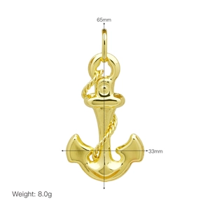 Macro view of gold anchor pendant measuring 65mm by 33mm with detailed rope design