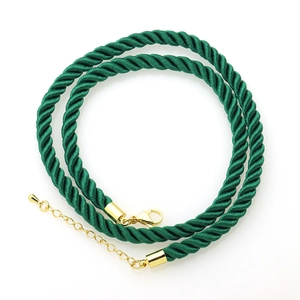 Close-up of dark green braided polyester twist cord with gold lobster clasp for jewelry