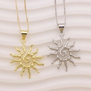 Minimalist sun pendant necklace in gold and silver finish with hammered metal texture
