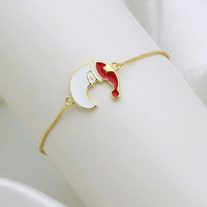 Adjustable golden snake chain bracelet with red and white enamel moon and Santa hat charm