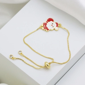 Adjustable gold Santa Claus charm bracelet with red enamel and shimmering cubic zirconia