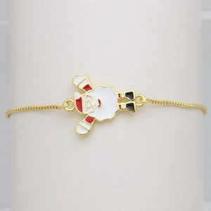 Detailed macro view of a golden adjustable bracelet with a colorful Santa Claus charm
