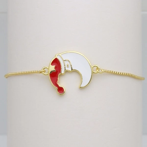 Detail of Christmas moon charm bracelet with red oil drip hat on gold box chain