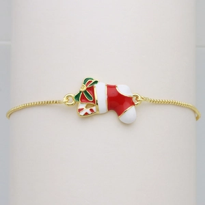 Close-up of golden box chain bracelet featuring a colorful Christmas stocking charm