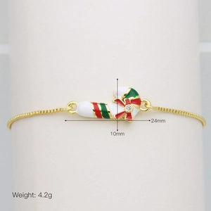 Detail view of gold box chain bracelet with colorful candy cane pendant and measurements
