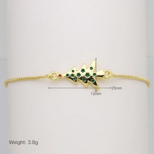 Close-up of golden Christmas tree charm with green enamel on adjustable box chain