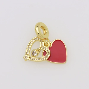 Detail of red enamel heart charm with gold openwork heart and white zircon accents