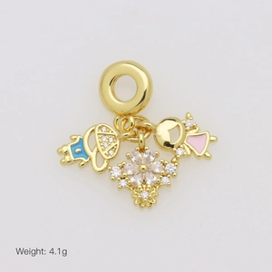 Detail of gold charms featuring a boy, girl, and zircon flower, weight 4.1g
