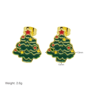 Detail of Christmas tree stud earrings with green enamel and red star decoration