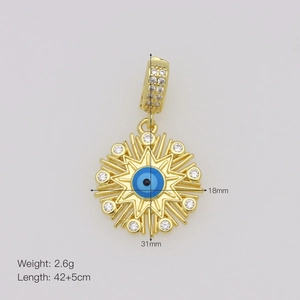 Detail view of 18K gold plated evil eye pendant with blue crystal and zircon stones