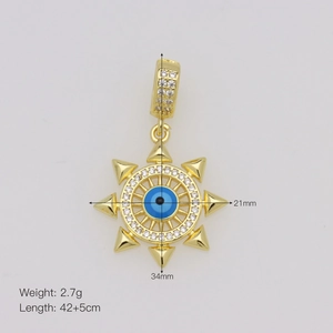 Detail of 18K gold evil eye pendant with blue center and dimensions 21mm x 34mm