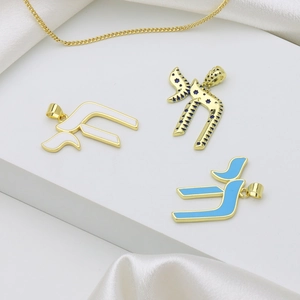 Gold-plated Hebrew letter pendants with white and blue enamel on silk display