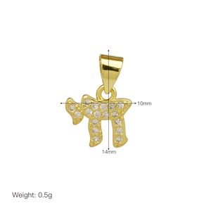 Detailed view of Chai pendant with pavé set crystals measuring 14mm by 10mm in gold