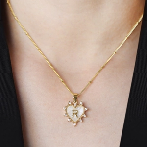 Golden heart pendant necklace with letter R shell inlay and sparkling zircon stones