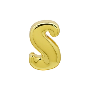 Close-up of polished gold-plated letter S charm with side holes for DIY bracelets