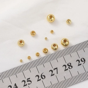 Polished 14K gold-filled round beads in various sizes for DIY jewelry making