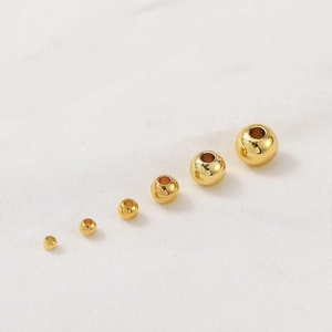 Polished 14K gold-plated beads in various sizes for DIY jewelry making and crafts