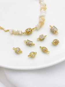 Detailed macro of 14K gold plated zircon hollow connector beads for jewelry making