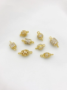Macro shot of 14K gold filled charms with micro-paved zircons for DIY jewelry making