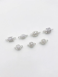 Macro shot of 14K gold filled charms with micro-pave cubic zirconia for DIY jewelry