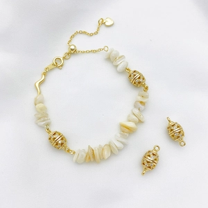 14K gold filled bracelet with shell stones and hollow pave zircon charms