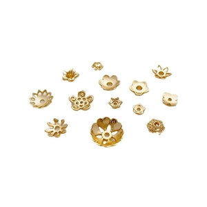 Various 14K gold plated flower bead caps for DIY jewelry making on white background