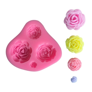 Pink silicone mold with four different sizes of 3D rose flower shapes for cake decorating