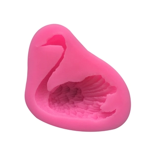Pink swan silicone mold for fondant and cake decorating with detailed feather texture