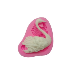 Detailed pink silicone swan mold showing intricate feather textures for fondant cake DIY