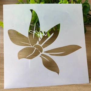Detailed macro view of a flexible white lily stencil for DIY painting on wood