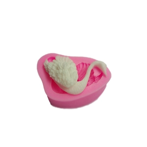 Detailed swan silicone mold for DIY cake decorating with intricate feather texture