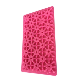 Pink silicone star and snowflake fondant press mold for cake and cookie decorating