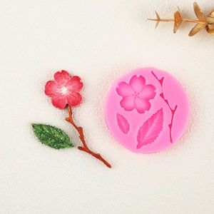 Pink silicone mold for fondant plum blossoms and leaves for cake decorating