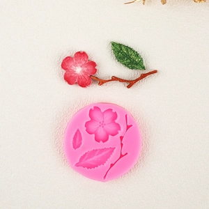 Pink silicone mold for cherry blossoms, petals and branches for fondant or clay work