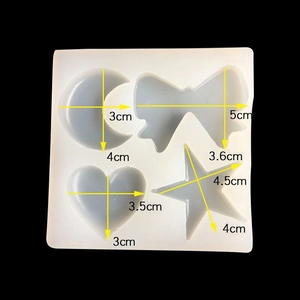 Translucent silicone mold showing dimensions for moon, bow, heart, and star shapes