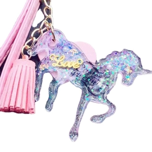 DIY handmade resin unicorn keychain with glitter sequins and pink leather tassel