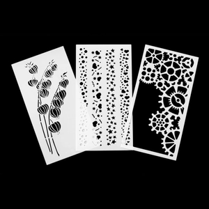 Set of 3 flexible plastic stencils featuring floral, heart, and gear patterns for DIY cake decorating