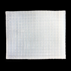Macro shot of white translucent silicone mold with small square grid texture pattern